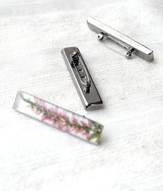 Long brooch with pink Heather flowers for a woman who is delighted with flowers and gardening. Real flowers preserved with crystal resin it looks romantic and magically. This delicate terrarium jewelry will be a charming gift for someone special. Brooch size: 50 mm x 10 mm (2 x 0,4 inches). here you can find other my brooches: ☘ https://www.etsy.com/shop/TinyIceFlower?search_query=brooch Also you can choose jewelry in my store: ☘ https://www.etsy.com/shop/TinyIceFlower Resin jewelry arrives in t Elegant Pink Jewelry With Pressed Flowers, Adjustable Pink Jewelry With Pressed Flowers, Pink Resin Jewelry With Pressed Flowers, Unique Flower-shaped Resin Jewelry, Resin Brooch, Flowers Romantic, Pink Brooch, Hypoallergenic Flower-shaped Resin Jewelry, Eco Friendly Accessories