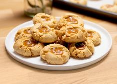 cookies with peanut butter and jelly on a white plate