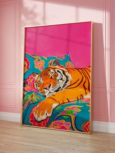 a painting of a tiger laying on top of a pillow in front of a pink wall