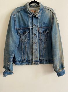 Vintage Big E Levi's 2 Pocket Distressed Denim Blanket Lined Jean Jacket Original San Fransisco Made Levi's Denim Made in USA Willing to Answer Any and All Questions about Items. All Items Sold AS IS. No Refunds. No Returns. Note* Items are not laundered unless adopted personally before selling, to reduce costs & to help combat the ongoing drought in California. For More Photos & Other Items Visit : DeadPeoplesShit.com Vintage Ripped Long Sleeve Outerwear, Vintage Long Sleeve Ripped Outerwear, Vintage Denim Jacket With Frayed Hem, Vintage Ripped Denim Jacket For Fall, Vintage Medium Wash Outerwear With Frayed Hem, Vintage Outerwear With Frayed Hem In Medium Wash, Vintage Medium Wash Denim Jacket With Frayed Hem, Vintage Denim Jacket With Frayed Hem In Medium Wash, Vintage Denim Outerwear With Frayed Hem