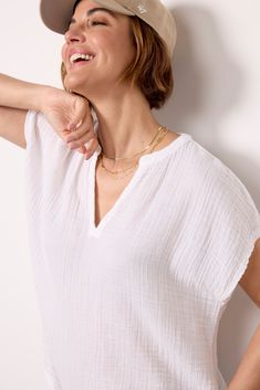 Breezy gauze fabric makes this Michael Stars top a summer-ready favorite. The easy, relaxed fit is perfect for pairing with everything from casual shorts and sandals to wide leg jeans and wedges. White Relaxed Fit Breezy Tops, Effortless V-neck Top For Vacation, Relaxed V-neck Blouse For Summer, Relaxed V-neck Summer Blouse, Versatile Relaxed Fit Blouse For The Beach, Spring Cotton Gauze Tops With Relaxed Fit, Spring Relaxed Fit Cotton Gauze Tops, Relaxed Fit Cotton Gauze Tops For Spring, Breezy V-neck Summer Top