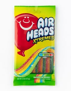 a bag of air heads xtremes candy on a white surface with a smiley face drawn on it