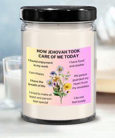 a jar with a poem on it sitting next to a glass filled with milk and flowers