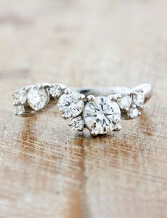 an engagement ring with three diamonds on it