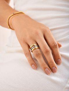 Unleash your bold side with the Moxie Ring. An extra long statement piece, this ring is gorgeously gold with a sliver of silver to create some mixed metal magic. Perfect for stacking or shining solo, the Moxie Ring adds a dash of daring to any look. Metal Magic, Dope Jewelry Accessories, Ups Shipping, Ring Styles, Opal Ring Gold, Stacking Ring Set, Jewels Rings, Evil Eye Ring, Linking Rings