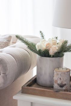 an instagram photo with flowers in a vase on a tray next to a bed