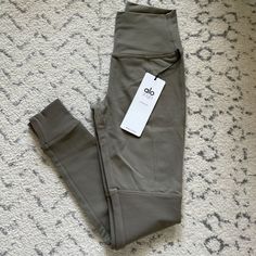 Alo Yoga High-Waist Avenue Legging - Olive Branch New With Tag Size Xs Price Is Firm. No Offers Or Trades Alo Yoga Sportswear Bottoms With Go-dry, Alo Yoga Moisture-wicking Sports Bottoms, Alo Yoga 4-way Stretch Bottoms, Alo Yoga 4-way Stretch Elastane Bottoms, Alo Yoga Leggings With 4-way Stretch For Yoga, Alo Yoga Pants, Alo Yoga, Olive Branch, Yoga Pants