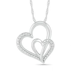 With double the love, this heart pendant is destined to delight. Fashioned in sterling silver, this charming look features two heart-shaped outlines - one larger interlocked with a smaller - each shimmering with diamond accents along a bead-detailed side. Polished to a bright shine, this pendant suspends along an 18.0-inch rope chain that secures with a spring-ring clasp. White Double Heart Diamond Accent Necklace, White Double Heart Diamond Necklace, White Diamond Double Heart Necklace, Double Heart Necklace With Diamond Accents For Anniversary, Mother's Day Double Heart Diamond White Jewelry, Silver Double Heart Diamond Jewelry, Diamond White Double Heart Jewelry For Mother's Day, Diamond White Double Heart Diamond Necklace, Double Heart Sterling Silver Jewelry With Heart Detail