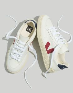 Founded in Paris, Veja makes eco-friendly sneakers that don't look eco-friendly (aka, they're feel-good shoes without the crunch factor). These versatile low-tops are made in Brazil from sustainable materials, including organic cotton and recycled polyester, plus soles made from a blend of recycled rubber, rice waste and natural wild rubber.Not sure what your European shoe size is? Our size chart will help you out.Leather upper.Imported.Madewell.com only. Paris Winter Fashion, Neutral Coat, What To Wear In Paris, Summer/fall Outfits, Veja Shoes, European Shoes, Mesh Sneakers, Fall Capsule Wardrobe, Summer Lookbook