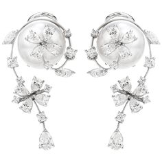 Presented by the acclaimed Designer Stefan Hefner, we are delighted to offer these exquisite and delicate Estate Earrings showcasing lustrous pearls adorned with brilliant diamonds. A floral motif, with movable flower accents - crafted in 18K White Gold and Italian made. Anchoring the earrings are a pair of 12mm High Luster South Sea Pearls of a beautiful soft silvertone and fine quality.  Surrounding each Pearl, (14) round Brilliant-Cut Diamonds, (18) Pear-Cut Diamonds & (4) Marquise-Cut Diamon Pearl Jewels, Golden South Sea Pearls, Jewelry Appraisal, Pear Cut Diamond, Pearl And Diamond Earrings, Sea Pearl, Earring Display, Emerald Earrings, Sea Pearls