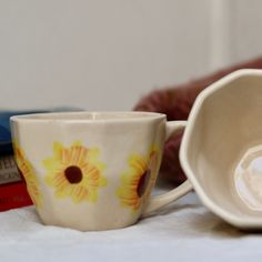 a coffee cup sitting on top of a table