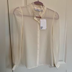 Gorgeous Pure Silk Ruffle Neck Long Sleeve Button Down Blouse By & Other Stories. Size 2, New With Tags. Last Photo Shows What A Perfect Match It Is With The J. Crew Skirt In My Closet (Size 2 Nwt). Perfect For A Monochromatic, Sleek, Elegant Outfit! Pair The Outfit With Nude Suede Heels And A Matching Handbag For An Upscale Daytime Look, Or Black Stiletto Sandals And Statement Jewelry For Night! Place Both Items In A Bundle To Save On Shipping. Similar To: Astr The Label Glossier Zara Lisa Says Workwear Blouse With Ruffled Collar And Buttons, Workwear Blouse With Buttons And Ruffled Collar, Classic Spring Blouse With Covered Buttons, Classic Blouse With Covered Buttons For Spring, Classic Tops With Button Closure And Ruffled Collar, Classic Blouse With Ruffled Collar And Button Closure, Classic Tops With Ruffled Collar And Button Closure, Feminine Blouse With Button Closure For Daywear, Feminine Formal Button-up Blouse