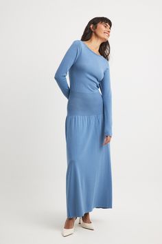 This maxi dress features a relaxed fit and a long-sleeved design. It has a stretchy knit and a boat neckline. Our maxi dress features a waist detail. Blue Long Maxi Dress For Fall, Modest Long Sleeve Blue Maxi Dress, Casual Blue Denim Maxi Dress, Blue Stretch Maxi Dress For Fall, Modest Blue Maxi Dress For Fall, Modest Long Blue Dresses, Future Fashion, Boat Neckline, Maxi Dress Blue