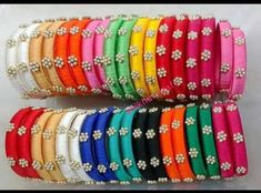 Silk thread bangles . 18 pairs bangles sets Bangles in bulk. Custom colours options available Bulk silk thread Bangles. Bangles gives you the charming vibes. These will look elegant with the traditional attires. Jewellery is an essential accessory that helps in enhancing the overall look of women's attire. These are found in many different styles and types. In today's time, women are attracted towards the light-weighted and artificial jewellery. The reason behind it is the different designs and Bangles Bridal, Traditional Bangles, Traditional Attires, Silk Thread Jewelry, Silk Thread Bangles, Thread Bangles, Artificial Jewellery, Thread Jewellery, Bridal Bangles