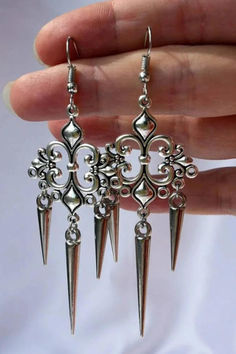 Victorian era earrings in silver color Silver Alloy Drop Clip-on Earrings, Nickel-free Alloy Earrings For Party, Elegant Alloy Clip-on Earrings For Party, Elegant Alloy Hoop Earring, Single Alloy Earring For Party, Single Earring For Party, Alloy Material, Single Earring Alloy For Party, Ornate Sterling Silver Earrings With Elegant Design, Silver Alloy Earrings For Wedding