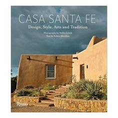 an adobe house with steps leading up to it and the words casa santa fe design, style, arts and tradition