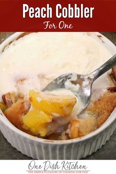 peach cobbler for one in a white dish with a spoon and text overlay