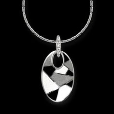 From work to evening wear this Black and white enamel pendant in sterling silver and set with white sapphires makes a stunning statement! White Gold Pendant Necklace With Black Enamel, Sterling Silver Necklace With Black Enamel, Elegant Oval Pendant Necklace With Black Enamel, Black Enamel Fine Jewelry Necklace, Elegant Enamel Necklaces With Polished Finish, Modern Silver Necklace With Black Enamel, Silver Oval Necklaces With Charms, Sterling Silver Pendant Necklace With Black Enamel, Silver Enamel Oval Pendant Necklace