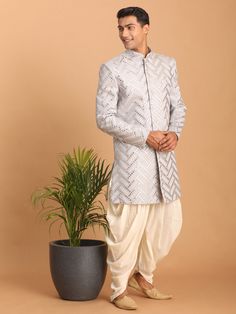 Vastramay Men's Aqua Blue Mirror Indo Western Sherwani With Dhoti Set A stunning aqua blue mirror indo western sherwani with dhoti set from VASTRAMAY. This attire features exquisite craftsmanship and is perfect for special occasions like weddings and festivals. Features Color: Aqua Blue Style: Indo Western Set Includes: Sherwani, Dhoti Embroidery: Mirror Work Occasion: Wedding, Festive Specifications Brand: VASTRAMAY Material: Fabric Size: Available in various sizes Wash Care: Dry clean only Mat Sherwani With Dhoti, Embroidery Mirror Work, Indo Western Sherwani, Embroidery Mirror, Blue Mirror, Color Aqua, Blue Mirrors, Indo Western, Blue Style