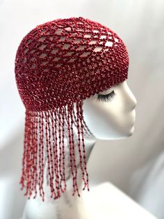 Introducing our Beaded Exotic Cleopatra Head Piece Cap, a mesmerizing fusion of ancient Egyptian allure and contemporary festival fashion. Inspired by the legendary beauty of Cleopatra, this headpiece is adorned with intricate beading, tassel chains, and a touch of gold mesh, exuding an exotic and enchanting charm. Crafted with care, this headpiece features plastic beads meticulously arranged to create a stunning visual effect reminiscent of the opulence of ancient Egypt. The stretchy cap design ensures a comfortable fit for various head sizes, making it an ideal accessory for festival-goers, costume parties, or anyone seeking to make a bold fashion statement. Whether you're channeling the spirit of Cleopatra herself or simply want to add a touch of exotic flair to your ensemble, our Beade Beaded Headpiece, Festival Hat, Tassels Fashion, Bead Crochet Patterns, Turbans, Coin Jewelry, Touch Of Gold, Cap Design, Red Bead