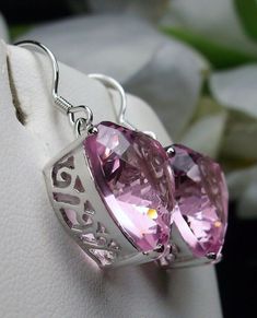 Simulated Pink Topaz Earrings Description Made to Order This is a brand new pair of Art Nouveau inspired sterling silver filigree heart-shaped Man-made/Simulated Pink Topaz gemstone earrings. The Gorgeous pink gems are 15mm (1/2th of an inch) by 15mm (1/2 inch) in size each. The earrings are 1 1/4th inch long. Notice the beautiful swirl like the craftsmanship of the silver filigree settings. This is a well made beautiful pair of sterling earrings and they are ready to wear. The color and clarity Heart Cut Pierced Earrings For Wedding, Pierced Heart Cut Earrings For Wedding, Pink Heart Cut Wedding Earrings, Heart Cut Wedding Earrings, Heart-shaped Earrings For Mother's Day Formal, Pink Heart Cut Earrings For Formal Occasions, Formal Pink Heart-cut Earrings, Elegant Pink Heart Cut Earrings, Formal Pink Heart Cut Earrings