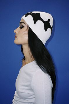 A cream knitted wool-blend beanie with black contrast artwork of a shooting star. Logo embroidered on the back. 50% wool, 50% acrylic Contrast Artwork, Beanie Aesthetic, Black Beanie Embroidery, Black Novelty Beanie For Winter, Black Novelty Beanie Hat, Black Acrylic Beanie, Black Novelty Beanie, White Beanie, White Beanies