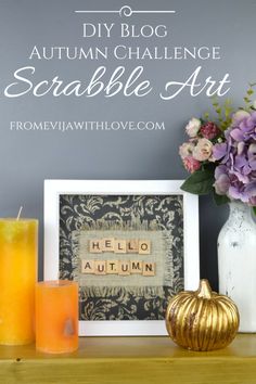 an autumn challenge with scrabble art and flowers on a shelf next to candles