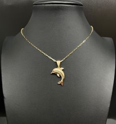 "Product Description: Immerse yourself in divine elegance with our 14k Real Gold Dolphin Pendants Necklace, with 14k Solid Gold 1.5mm Paperclips Chain Necklace , Dolphin Charm, 14k Solid Gold Dolphin Charm, a heavenly ensemble crafted to elevate your style. Item Features: Material: Expertly crafted from 14K Genuine Gold, ensuring a touch of luxury and authenticity. Chain Style: A mesmerizing blend of Dolphin Charm and a 1.5mm Paperclips Chain, offering a unique and stylish design. Stones: Embellished with Zirconia stones, adding a subtle sparkle to the Dolphin charm. Metal Stamp: Properly stamped with 14K for both the pendant and the chain, a mark of genuine gold. Available Lengths: Choose from various lengths - 16\", 18\", 20'', 22'', 24'' for a personalized fit. Weight: The Dolphin penda Dolphin Charm, Dolphin Pendant, Angel Pendant Necklace, Real Gold Chains, Diamond Rings Design, Pendants Necklace, Angel Pendant, 14k Gold Necklace, Gold Accessories