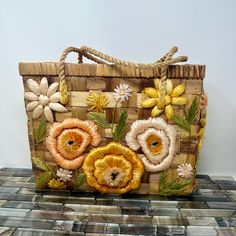 a handbag with flowers painted on it