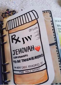 an open notebook with a drawing of a jar of jehovah