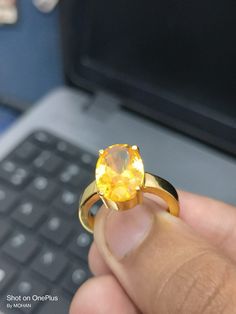 Yellow sapphire, also known as "Pukhraj" in Hindi, is a gemstone that belongs to the corundum family, just like blue sapphire. It is the yellow variety of corundum and is valued for its vibrant yellow color. Yellow sapphire is composed of aluminum oxide (Al2O3) with traces of iron that give it its yellow hue. The color of yellow sapphire can range from pale yellow to intense golden yellow. The most prized and valuable yellow sapphires typically exhibit a pure, vibrant yellow color without any hi Yellow Gemstone Ring, Ring For Man, Cultural Beliefs, Yellow Gemstones, Vedic Astrology, Light Reflection, Yellow Sapphire, Pale Yellow, Ring Handmade