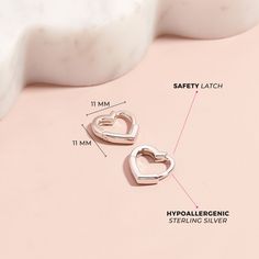 A simple pair of heart shaped huggie hoop earrings that any teen girl would love to receive as a special birthday present or valentines day gift. She will love the snug fit of this simple huggie, crafted from a 925 sterling silver, this pair of huggies are both safe and comfortable for young girls with sensitive ears. Featuring a hinged closure for more security, these earrings will surely become her go to pair with all of her outfits. Gift box included with purchase. Silver Heart Charm Huggie Earrings, Trendy Huggie Hoop Earrings With Heart Charm, Silver Huggie Earrings With Heart Charm, Trendy Huggie Heart Earrings For Valentine's Day, Silver Huggie Earrings With Heart Charm For Gift, Trendy Heart Charm Earrings For Anniversary, Hypoallergenic Heart-shaped Huggie Earrings In Sterling Silver, Silver Heart-shaped Hypoallergenic Huggie Earrings, Silver Hypoallergenic Heart Huggie Earrings