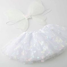 Cute Little Girls Angel Wing Tutu Set Unstretched: 8" Length: 7" Spring Dress-up Sets In White, White Dress-up Sets For Spring, White Skirt For Spring Costume Party, Cute White Dress-up Sets, Playful White Fitted Skirt, Fitted White Sets For Dress-up, White Fitted Sets For Dress-up, Cute Stretch White Sets, White Fitted Dress-up Sets