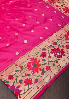 Elevate your style with this exquisite Fuchsia Pure Banarasi Katan Silk Saree, a stunning example of traditional craftsmanship and vibrant elegance. The saree's bold fuchsia hue captures attention with its rich, vivid color, offering a striking and sophisticated look. Woven from pure Katan silk, it features a luxurious texture and a graceful drape that enhances its overall charm. Adorned with intricate coin motifs, the saree showcases detailed patterns that reflect the timeless artistry of Banarasi weaving. The Meenakari Paithani border and pallu add an extra layer of opulence, with their exquisite enamel work and vibrant colors beautifully complementing the fuchsia silk. This combination of classic motifs and intricate detailing makes the saree an ideal choice for festive occasions and gr Luxury Katan Silk Salwar Kameez With Motifs, Luxury Pink Paithani Silk Traditional Wear, Luxury Pink Paithani Silk Saree, Luxury Meenakari Saree For Festivals, Luxury Paithani Silk Salwar Kameez For Festivals, Luxury Paithani Silk Salwar Kameez For Festive Occasions, Luxury Paithani Silk Saree With Border, Luxury Katan Silk Saree With Meenakari Detail, Luxury Paithani Silk Salwar Kameez With Pallu