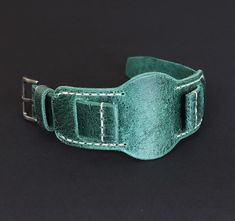 -Leather Cuff Watch Strap of High quality. Will appeal to connoisseurs of vintage style. The strap is durable, does not stretch, pleasant to the touch, soft and perfectly fits the wrist. -Distressed leather watch band in a beautiful green color with a noble sheen and a vintage effect. Perfectly complement your image, individual style and will serve you for many years. Compatible with 18mm, 20mm, 22mm, 24mm watch case. Custom Handmade leather watch strap looks stylish while adding vintage and charm to your watch. The perfect gift for your loved one. -Made of best English distressed leather. Due to the peculiarity of the leather from which the strap is made, there cannot be two such identical straps. The edges of the strap are processed in a natural way, without paint and chemicals. Fastened Vintage Watch Bands For Everyday Use, Vintage Cuff Bracelet Strap Watch Accessories, Vintage Cuff Watch Bands With Bracelet Strap, Vintage Cuff Bracelet Watch Bands, Vintage Cuff Watch With Leather Strap, Leather Watch Band, Cuff Watch, Leather Watch Strap, Leather Watch Bands