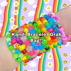 colorful bracelets with smiley faces are on the wrist of a person's hand