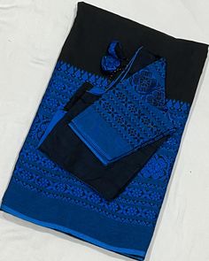 This beautiful handloom Khadi cotton saree features a striking black and blue floral pattern that is both elegant and timeless. The saree comes with a matching stitched blouse that is adjustable and fits sizes 34-42, ensuring a perfect fit for a range of sizes. The high-quality handloom fabric is breathable and comfortable, making it ideal for any occasion. Don't miss out on adding this versatile and stunning saree to your collection! Disclaimer: Please note that due to the handloom nature of th Unstitched Black Cotton Sets, Black Cotton Sets With Printed Motifs, Black Traditional Sets With Printed Motifs, Traditional Black Sets With Printed Motifs, Festive Black Blouse Piece With Printed Border, Festive Black Blouse With Printed Border, Traditional Black Cambric Sets, Traditional Unstitched Black Blouse Piece, Unstitched Black Saree With Printed Border