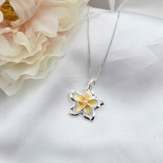 This Sterling Silver Plumeria Necklace is the perfect accessory for anyone looking to add a touch of Hawaiian-inspired style to their summer jewlery collection. Crafted with 925 sterling silver, this beautiful necklace features a colorful plumeria flower surrounded by intricate detail. The ideal beach gift, this plumeria pendant is sure to make a lasting impression. - Comes ready to wear on a 925 sterling silver chain of your choice length. Comes standard on a box style chain.  - solid sterling Yellow Sterling Silver Flower Jewelry, Flower Shape Jewelry As A Gift With Polished Finish, Flower Shaped Polished Jewelry As Gift, Flower-shaped Polished Jewelry Gift, Sterling Silver Flower Necklace For Gift, Flower Shaped Jewelry With Polished Finish For Gift, White Sterling Silver Flower Pendant Jewelry, White Sterling Silver Flower Necklace, Sterling Silver Flower Necklace In White Gold