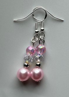 Pink Dangle Pearl Earrings, Pink Dangle Pearl Earrings With Ear Wire, Elegant Pink Crystal Earrings With Round Beads, Elegant Iridescent Beaded Earrings For Gift, Elegant Pink Pearl Drop Beaded Earrings, Pink Beaded Pearl Drop Earrings For Gift, Pink Pearl Drop Beaded Earrings For Gifts, Pink Hypoallergenic Dangle Crystal Earrings, Pink Adjustable Pearl Drop Earrings