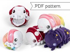 three stuffed animals with different colors and sizes