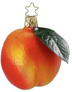 a close up of a fruit ornament with leaves on it's side