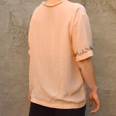 Pastel orange unisex t-shirt Hand-made "flames" embroidery Unique creation, made in France 🇫🇷 The female model measures 1m60 Machine washable Embroidered Relaxed Fit T-shirt For Streetwear, Oversized Casual T-shirt With Embroidery, Oversized Casual Embroidered T-shirt, Casual Oversized Embroidered T-shirt, Oversized Orange Summer T-shirt, Summer T-shirt With Embroidered Text And Short Sleeves, Summer Relaxed Fit T-shirt With Embroidered Text, Peach Relaxed Fit Short Sleeve T-shirt, Orange Relaxed Fit Tops For Streetwear