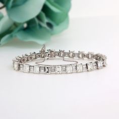 14.50 TW Emerald And Baguette Cut Diamond Tennis Bracelet Platinum 6.75" Estate Metal: Platinum Hallmark: PLA Bracelet Measurements: 6.75" in Length x 6.30 mm in Width & 4.50 mm Thick Weight: 21.2 gr total gram weight Approximately 14.50 TW Diamonds: 22 Prong Set, Natural, Emerald Cut Diamonds, totaling approximately 13.50 TW  Diamond Quality: G-I color; VVS-SI1 clarity Diamonds: 22 Prong Set, Natural, Baguette Cut Diamonds, totaling approximately 1.00 TW  Diamond Quality: G-I color; VVS-SI1 cla Bracelet Measurements, Diamond Tennis Bracelet, Delray Beach, Baguette Cut Diamond, Tennis Bracelet Diamond, Baguette Cut, Emerald Cut Diamonds, Natural Emerald, Tennis Bracelet