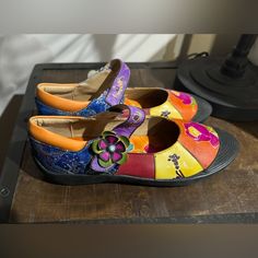 Make A Statement With Your Shoe Game With These Soffia Women's Festival Mary Jane Flat Shoes. These Multicolor Leather Shoes Are Perfect For Any Festival Or Boho Occasion. The Mary Jane Style And Floral Pattern Add A Touch Of Femininity To Your Outfit. These Beauties Feature A Gorgeous Multi-Layer Velcro Closure. The Shoes Are Designed For Women And Come In Size 8. These Mary Janes Sport Rubber Accents And Rubber Soles. These Shoes Are Perfect For Any Woman Who Wants To Add A Pop Of Color And Sh Casual Multicolor Leather Shoes With Round Toe, Multicolor Slip-on Leather Shoes For Spring, Multicolor Closed Toe Leather Shoes For Spring, Multicolor Leather Shoes With Round Toe For Spring, Spring Multicolor Leather Shoes With Leather Sole, Multicolor Round Toe Flats For Spring, Multicolor Leather Shoes With Round Toe, Multicolor Leather Shoes With Round Toe And Leather Sole, Multicolor Leather Closed Toe Flats