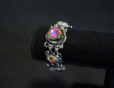 "This stunning Schiaparelli bracelet really sparkles. The large watermelon rhinestones are super bright and emanate a wide array of colors. There is a little wear on the metal on the back of the bracelet (see pics) but to me it seems perfectly normal for its age. All stones accounted for. Signed \"Schiparelli\" on back. Width - 1\"  Length - 7\"  Find more vintage bracelets from my shop here! ~ https://www.etsy.com/shop/AnnWoodallStudios?ref=seller-platform-mcnav&section_id=22220877 If you are i Schiaparelli Jewelry, Professional Jewelry, Fringe Necklace, Vintage Bracelet, Rhinestone Necklace, Antique Shops, Vintage Bracelets, Vintage Jewellery, Austin Tx