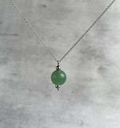 "Green jade pendant necklace for women. Explore ways to layer this piece or wear it on its own for a minimal look. Dainty, minimal, hypoalergenic, lightweight,  stylish necklace. Great gift idea for women (wife, girlfriend, mom, sister...). Necklace length: 36 cm (14\") + 5cm (2\") chain extension.  Please email me for a longer or shorter size of the necklace. Green jade bead - 10 mm. GREEN JADE (NEPHRITE): * is the stone of spiritual wealth and physical vitality * it is best known for it's posi Jade Clavicle Chain Necklace, Elegant Jade Necklace With Adjustable Chain, Minimalist Crystal Pendant Necklace With Delicate Chain, Long Jade Necklace For Gift, Minimalist Jade Round Pendant Jewelry, Minimalist Pendant Charm Necklaces For Meditation, Minimalist Crystal Necklaces With Round Pendant, Minimalist Crystal Necklaces With Round Pendant And Delicate Chain, Silver Minimalist Beaded Necklace With Short Chain