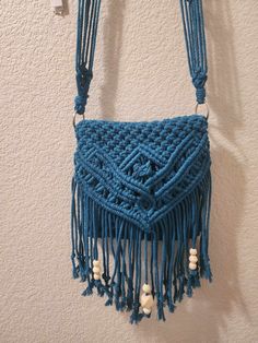 "This is a handmade macrame unique cross-body bag that features a Josephine knot. This one has fringe, beads and unique knots to create this beautiful pattern! Each purse purchase comes with a FREE zipper pouch to carry inside! This bag is made with 3mm cotton 3-ply twisted cord.   The dimensions of this bag are: 8.5\" wide 8.5\" pouch height 14\" from top to end of fringe Strap drop is 27\"  IMPORTANT: Due to the nature of handmade items the finished product may vary slightly from pictures. Thank you for supporting our small business!" Macrame Crossbody Bag, Macrame Unique, Josephine Knot, Beads Bag, Accessories Beads, Purse Handmade, Boho Fringe, Handcrafted Accessories, Handmade Macrame