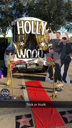 the hollywood walk of fame has been decorated with red carpet and gold star decorations on it