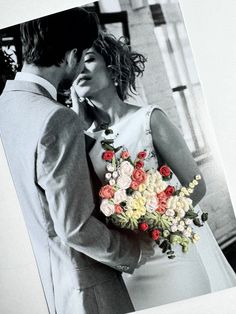 a black and white photo of a bride and groom