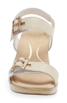 Adjustable buckles at the vamp and ankle help customize the fit of this supportive sandal lifted on a block heel. 2 1/4" heel; 1/2" platform Leather upper and lining/synthetic sole Imported Beige Low Heel Sandals With Buckle Closure, Medium Width Low Heel Wedge Sandals With Buckle, Beige Ankle Strap Wedge Sandals With Buckle, Beige Ankle Strap Wedge Sandals With Buckle Closure, Cream Wedge Sandals With Heel Strap And Block Heel, Cream Wedge Sandals With Block Heel And Heel Strap, Beige Wedge Sandals With Buckle Closure And Block Heel, Beige Wedge Sandals With Buckle And Block Heel, Beige Block Heel Wedge Sandals With Buckle Closure